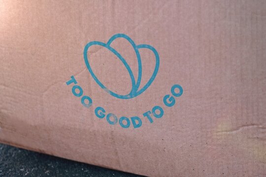  Neu-Ulm, Germany - February, 28, 2026: Close-up of  Parce with almost expired food, saved from waste with Too Good To Go app. Zero waste grocery shopping via app fighting with throwing out food.	