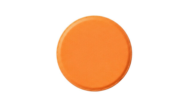 Isolated vibrant orange clay target, a round disc used for trap and skeet shooting practice