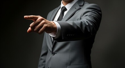 A man in a suit pointing