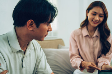 Fototapeta premium Couple Discussing Costs and Premiums with Financial Advisor