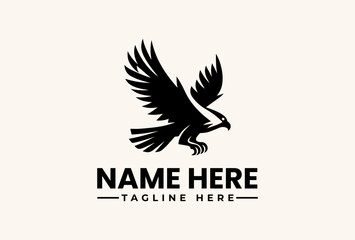 Fototapeta premium A black vector illustration of an eagle with outstretched wings and a placeholder text 'NAME HERE' and 'TAGLINE HERE' in a simple, modern design against a beige background.