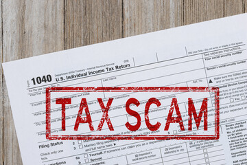 Fototapeta premium Tax scam warning on US 1040 tax form