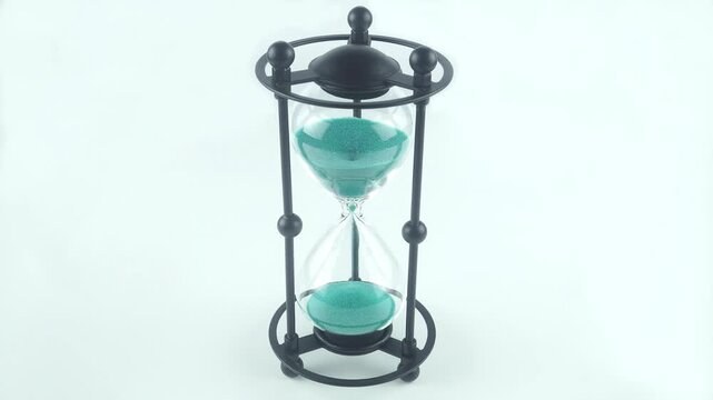 An Elegant Home Accessory In The Shape Of An Hourglass Made Of Metal And Gla