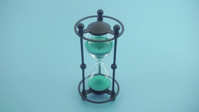 An Elegant Home Accessory In The Shape Of An Hourglass Made Of Metal And Gla
