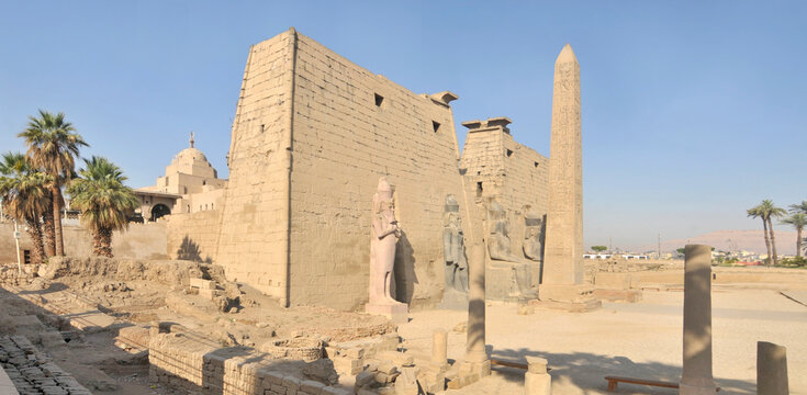 Pylon of the ancient Egyptian temple in Luxor with the Obelisk and with statues of pharaohs, Egypt