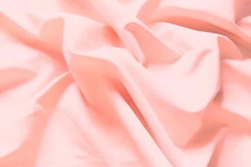Obraz premium ​Soft pink crumpled fabric texture, elegant aesthetic pastel silk background.