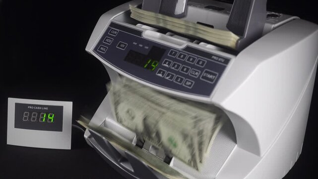 Machine For Counting And Checking The Authenticity Of Dollar Bills.
