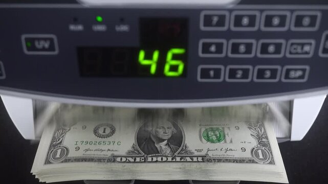 Machine For Counting And Checking The Authenticity Of Dollar Bills.