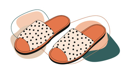 Fototapeta premium Pair of comfortable home slippers with an orange base and white tops featuring a black polka dot pattern on abstract background.