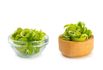 Fresh lime zest isolated on white background. Lime zest or peel close-up. Grated citrus peel. Lime...