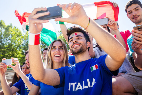 Italian sports fans taking selfie during celebration