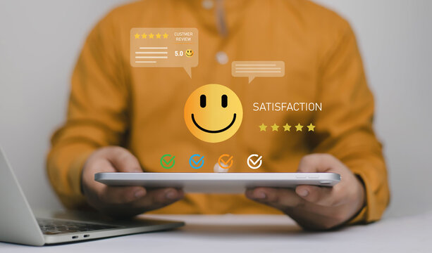Customer satisfaction feedback concept with smiley rating icon and five star review on tablet. Symbol of positive customer experience, service quality evaluation, online review and business reputation