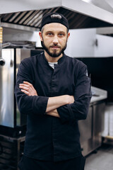 Portrait of chef standing at restaurant kitchen