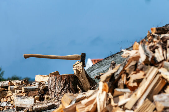 Chopped firewood with chopping block and axe