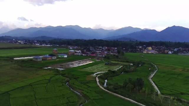 Panorama of Cupak Village, Kerinci, Jambi in the afternoon with stretches of rice fields and residential areas