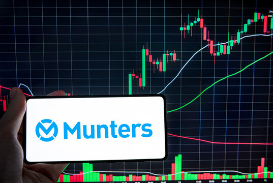 Munters ab logo on a smartphone infront of a random chart. Link&ouml;ping, &Ouml;sterg&ouml;tland, Sweden. 03-12-2026