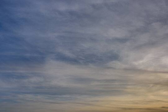 Blue cloudy sky. Serene dreamy background. Photo of a natural cloudscape
