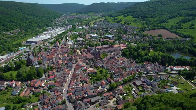 An aerial view beside the old town above the city Amorbach , Germany on a sunny day in spring