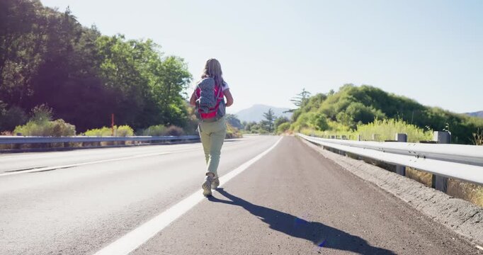 Solo Traveler Walking on Empty Highway