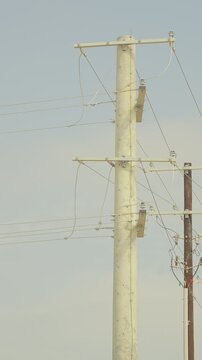 Power transmission pylons electrical grid infrastructure - vertical video
