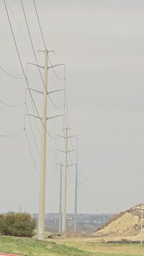 Power transmission pylons electrical grid infrastructure . vertical video
