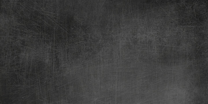 Vintage dark grunge texture with a rough black and white pattern on an old weathered surface creates a blank grey wall backdrop for a dirty industrial design