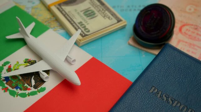 On map, next to passport and Mexican flag, toy airplane flies, concept symbolizing beach tourism and visa processing for air travel to south.
