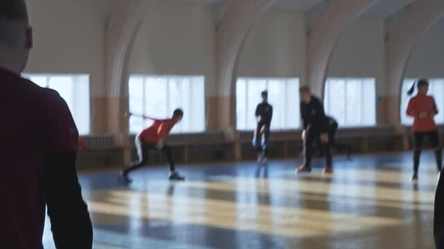 Schoolchildren play the old Russian game of lapta in the gym