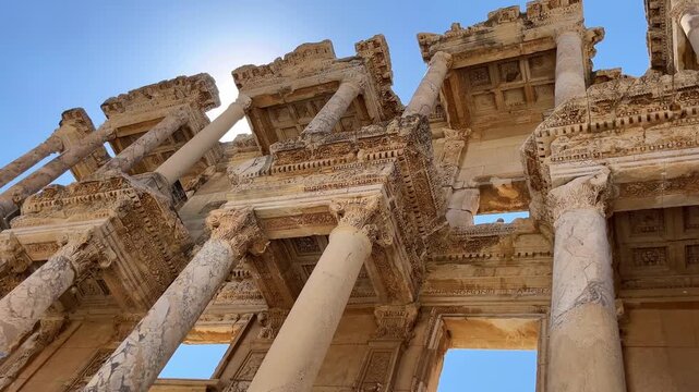 Low angle view of the Library of Celsus in Ephesus, Turkey. Famous ancient Roman landmark with detailed marble columns and facade, one of the most important archaeological sites in the Mediterranean.