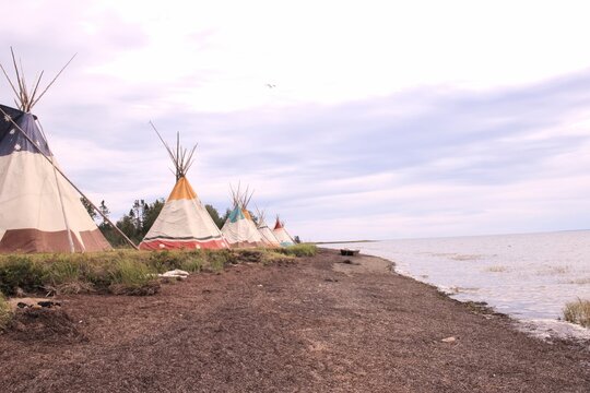 Traditional Mi'gmaq Tipis on the Shoreline of Gesgapegiag, Gaspe Peninsula, Quebec, Canada