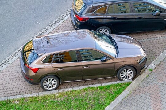 Brown Skoda Scala hatchback parken on street, top side view