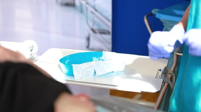 Stoma care training demonstration showing correct wiping direction on model using aseptic technique in nursing
