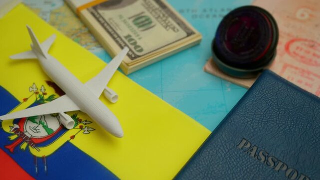 Travel concept with airplane, stamped passport, and dollar notes over world map showing Ecuador flag, symbol of South American tourism.