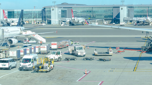 Elliott Trudeau International Airport scene with aircraft, ground vehicles, and terminal building showcasing busy travel atmosphere and operational logistics