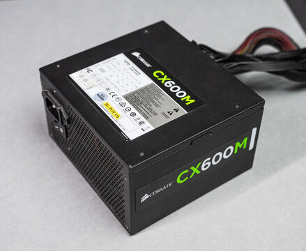 Gothenburg, Sweden - december 28 2024: Corsair CX600M modular power supply unit photographed on table surface.