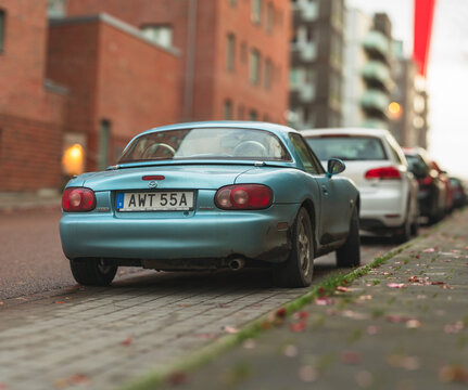 Gothenburg, Sweden - november 02 2025: Blue Mazda MX5 Miata sports car parked on city street in autumn.