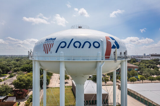 Aerial Drone View of Large White Water Tower Near Surrounding Neighborhood in Plano, Texas Close Up