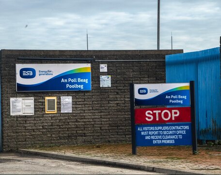 Entrance to ESB's An Poll Beag Poolbeg facility in Dublin, Ireland, featuring a brick wall with signage for the Energy Supply Board (ESB)