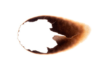 Fototapeta premium Paper sheet with irregular burnt hole and dark scorch marks isolated on white background