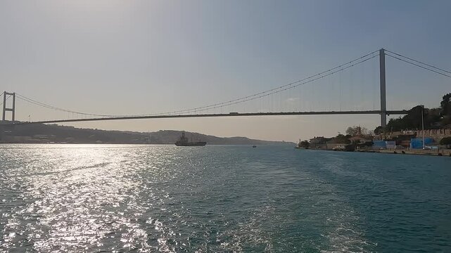 Istanbul strait. Super Tanker Ship Cruising Along Bosporus. Tanker ship pass through the bosporus with bosphorus bridge in istanbul turkey. Sea freight transportation concept. Transport logistics.