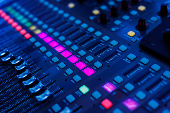 Concert sound mixer panel with volume regulators. Professional audio and light equipment for sound recording studio, live music broadcasting, television, party. mixing console. audio signals