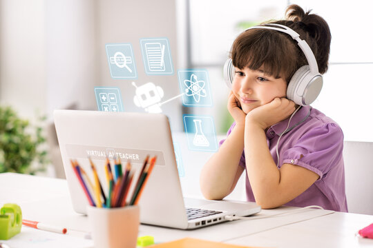 Primary school student using a laptop with virtual AI assistant icons for personalized digital learning at home