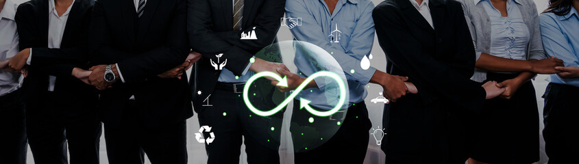 A diverse group of professionals stands together with crossed hands, symbolizing teamwork, collaboration, and unity, featuring icons of sustainability and innovation above. Trope © InfiniteFlow