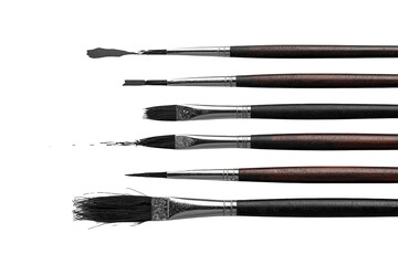 Fototapeta premium Artist paint brushes and palette knife with black bristles creating lines, art supplies on transparent background