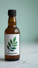 A glass bottle of dark liquid with a white label is centered on a white surface. A green leaf is subtly positioned near the bottle. The lighting is soft, highlighting the bottle's form.