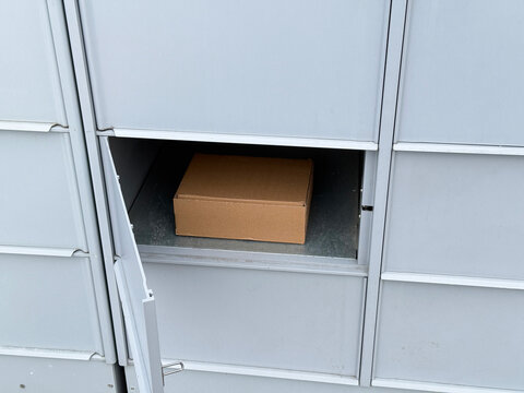 Package delivery in residential parcel locker box.