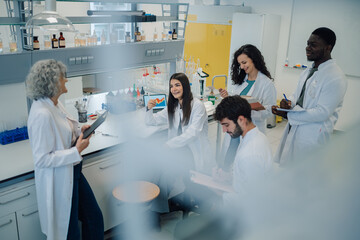 Scientists team collaborating in a modern laboratory research setting