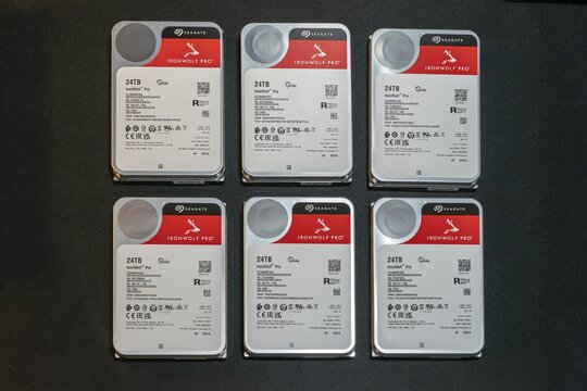 Six 24TB Seagate IronWolf Pro HDDs for NAS Storage Systems. High-capacity hard disk drives arranged in grid, ideal for AI, network-attached storage and data center applications.