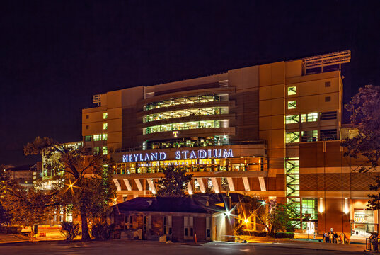 The exterior of Neyland Stadium at night. Neyland Stadium is the home of the University of Tennessee Volunteers. There is copy space in the image.