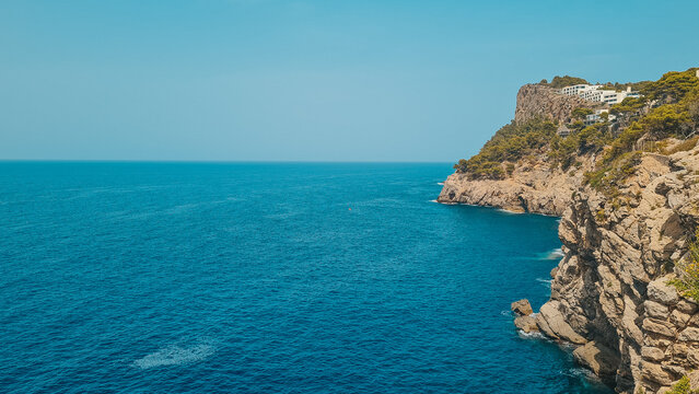 Dramatic Rocky Cliffs Over Deep Blue Mediterranean Sea in Mallorca